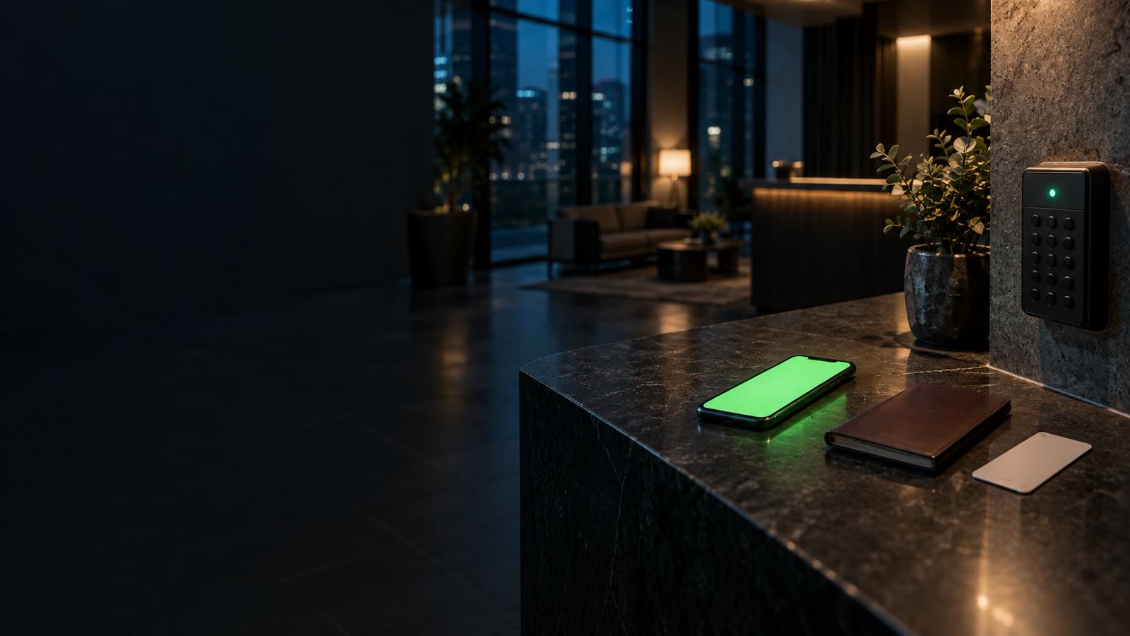 A smartphone with a green glowing screen lies on a dark stone reception counter at night beside a passport and a keycard, with a numeric code lockbox on the wall